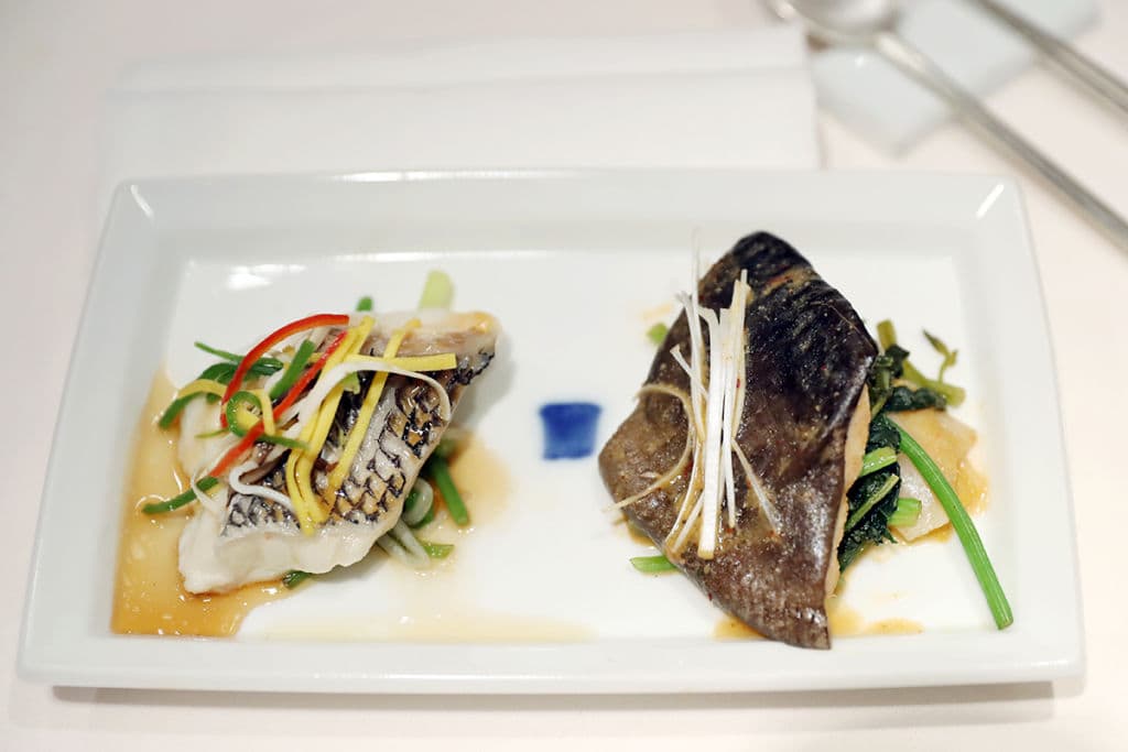 It was found that children who eat fish at least once a week score 4.8 points higher than those who never do (Photo by Korea Summit Pool/Getty Images)