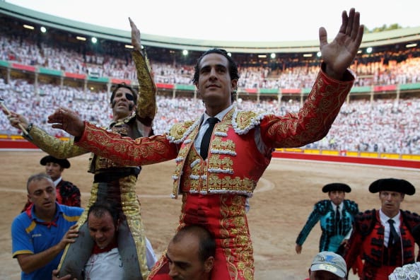 Bullfighters Juan Jose Padilla, left, and Ivan Fandino leave the bullring through the Puerta Grande 'Big Door' on July 13, 2013 in Pamplona, Spain (Getty Images)