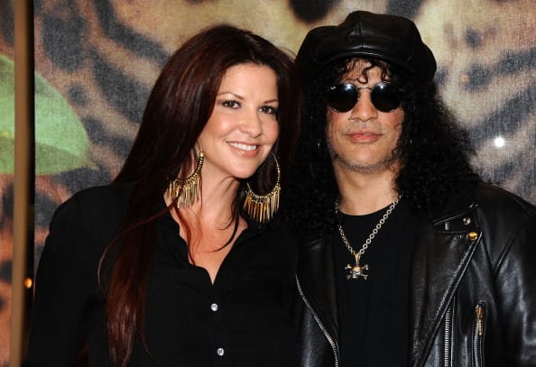 Guitarist Slash and Perla Hudson attend the unveiling of the 2012 Gibson Guitartown new round of guitars on The Sunset Strip at Hornburg Jaguar on March 12, 2012 in Los Angeles, California. Source: Angela Weiss/Getty Images