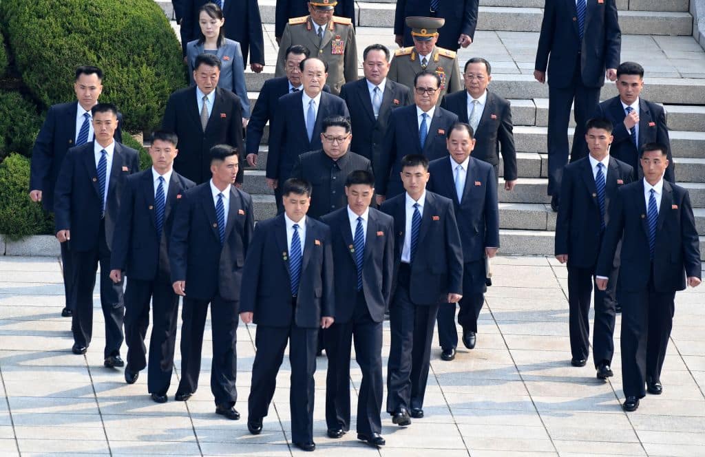 North Korean leader Kim Jong Un flanked by his security unit. (Getty Images)
