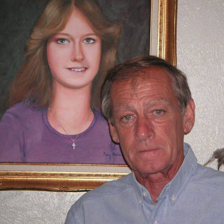 Tim Miller standing in front of a portrait of his daughter, Laura Miller (Facebook)