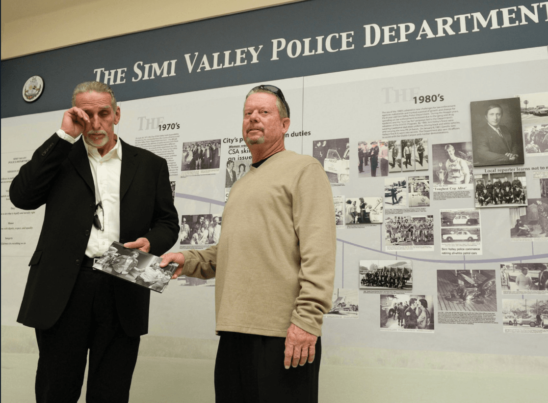 Craig Coley joins Rick Freeman, the officer who arrested him in 1978, at the Simi Valley PD to remove a painful reminder from history (Twitter)