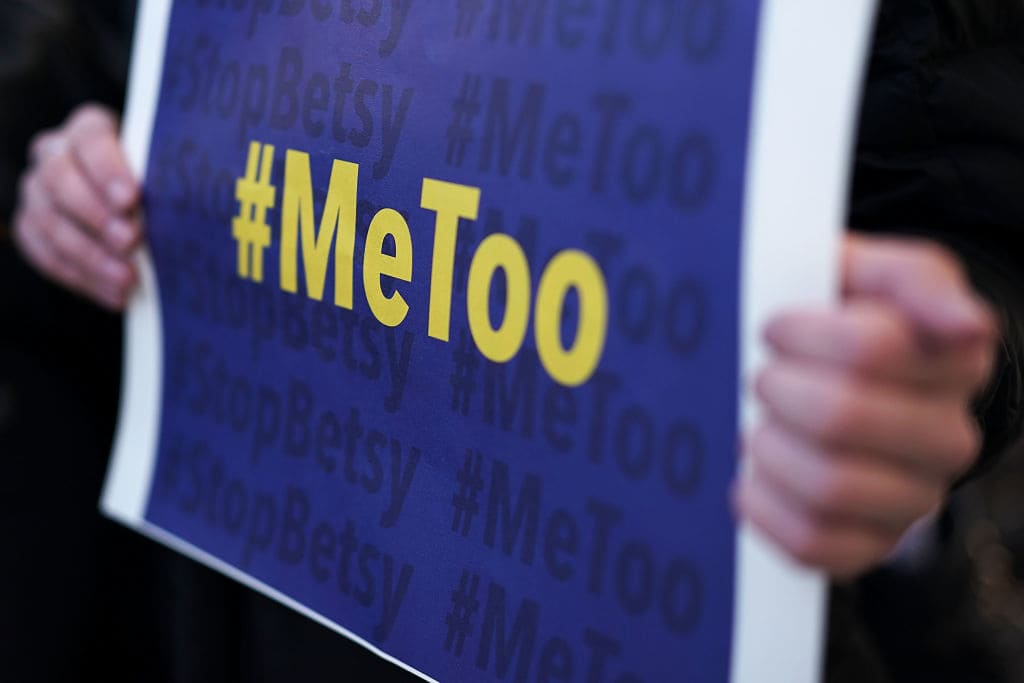 An activist holds a #MeToo sign during a news conference on a Title IX lawsuit outside the Department of Education January 25, 2018 in Washington, DC. (Getty Images)