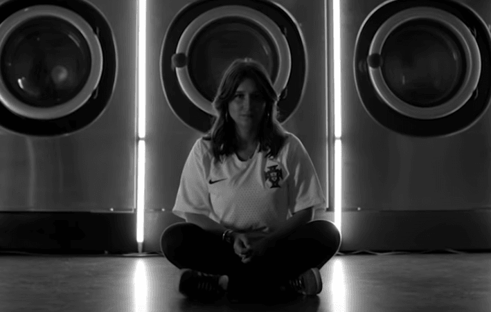 The new video of the song sees fans supporting their team wearing the jersey. (YouTube)