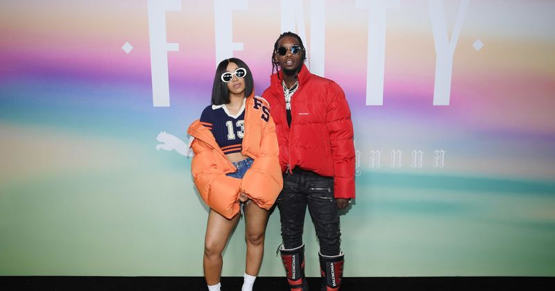 Cardi B reveals her growing baby bump as she strikes a pose with Offset for the cover of a magazine