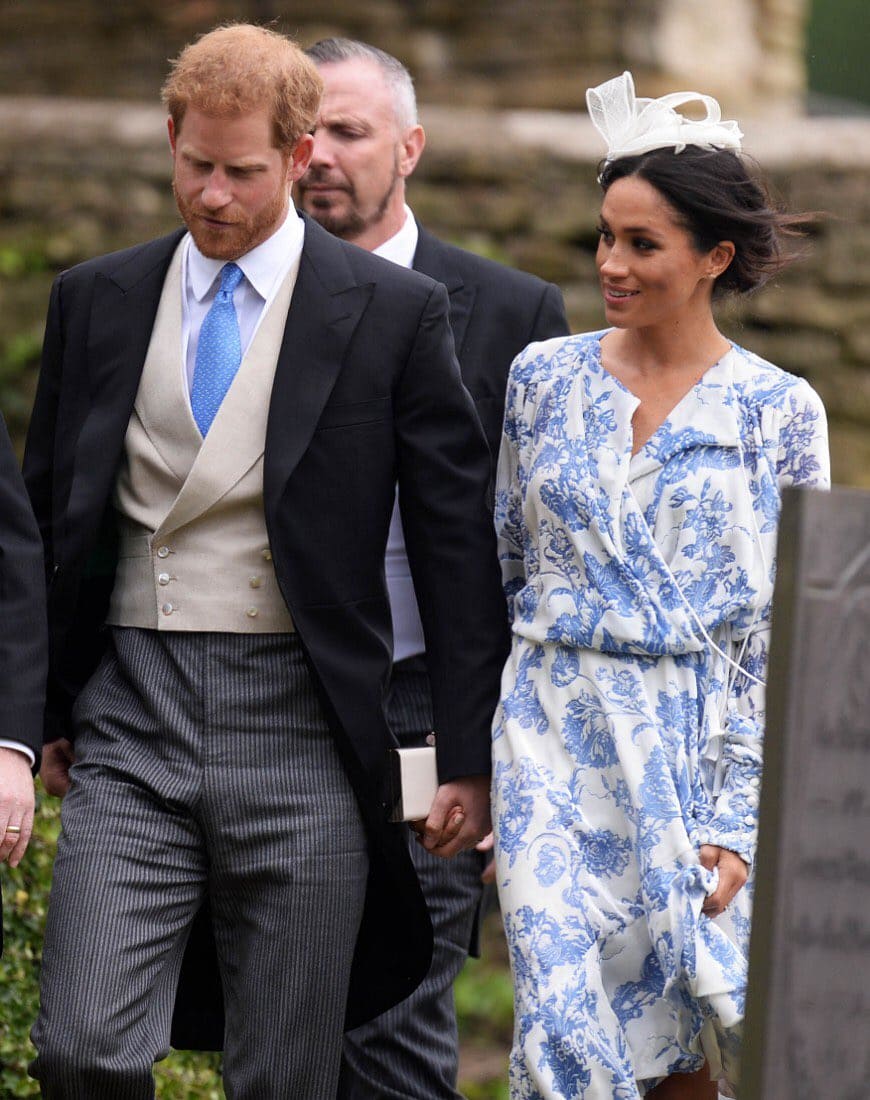 Twinning: Harry matched his wife's blue and white Oscar de la Renta creation (Twitter)