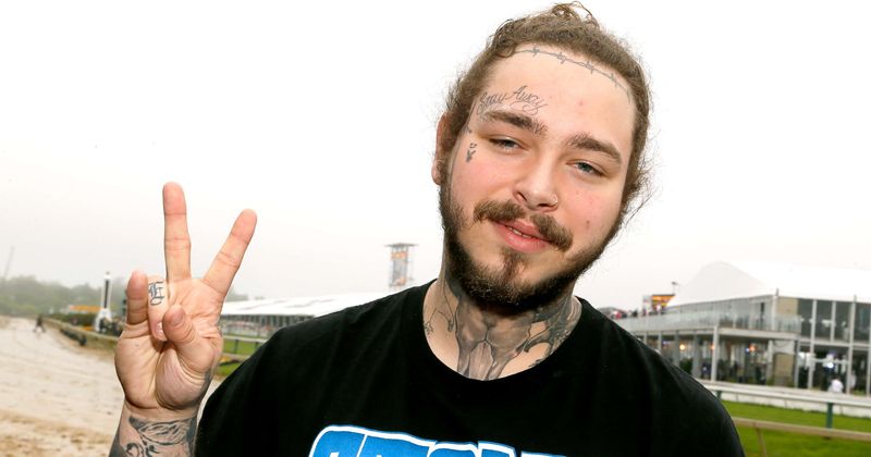 Smash hit: The Undertaker chokeslammed Post Malone at his concert