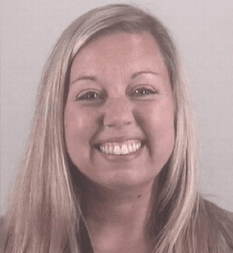 33-year-old former school counselor Shannon Hathaway, grins in her prison mugshot (Twitter)