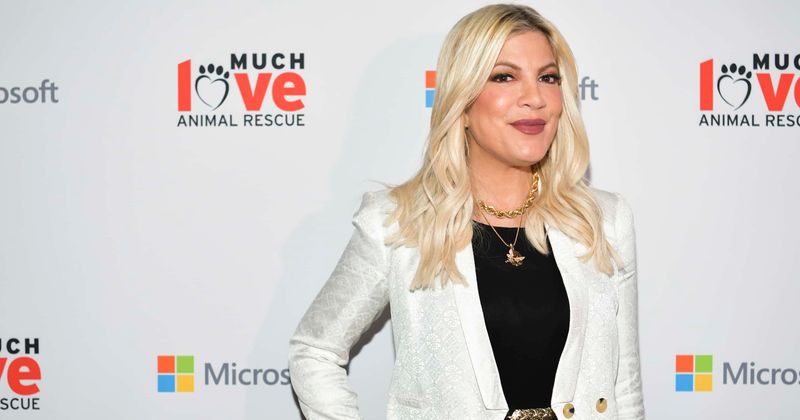 Tori Spelling takes down swimsuit photo after being slammed for photoshopping it to proclaim body positivity