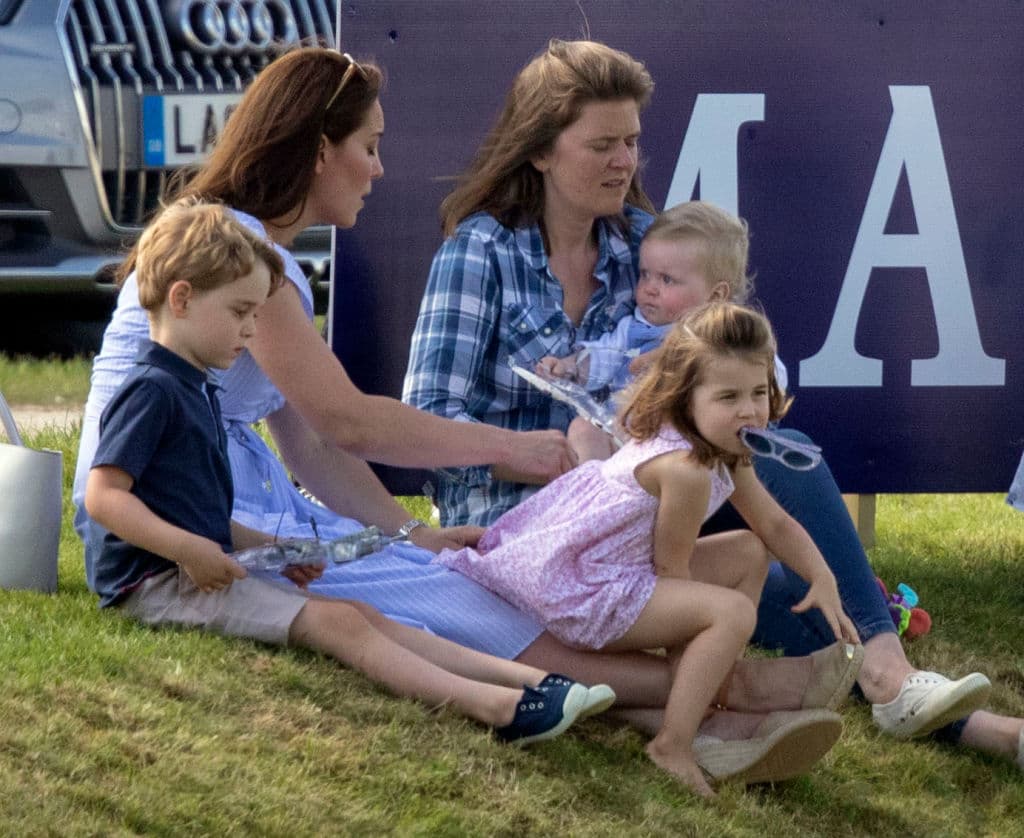 The Duchess of Cambridge (left) with Prince George and Princess Charlotte, as her husband the Duke of Cambridge takes part in the Maserati Royal Charity Polo Trophy at the Beaufort Polo Club, Downfarm House, Westonbirt, Tetbury. (Photo by Steve Parsons/PA Images via Getty Images)