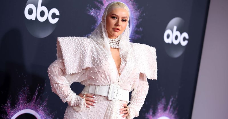 Break free: Christina Aguilera poses topless in super fiery pictures to promote new album 'Liberation'