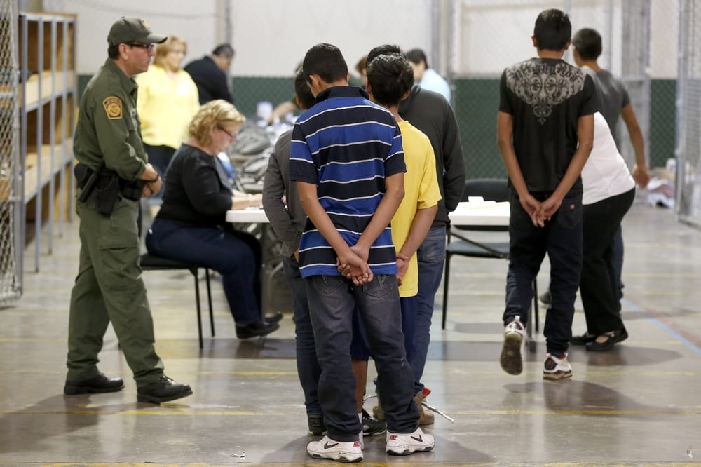 Immigrant children being processed and held at the US Customs and Border Protection Nogales Placement Center on June 18, 2014, in Nogales, Arizon (Photo by Ross D. Franklin-Pool/Getty Images)