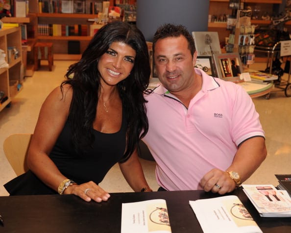 Teresa Giudice and her husband Joe greet fans and signs copies of her book 'Fabulicious On The Grill' at Books and Books at Museum of Art on June 21, 2013 in Fort Lauderdale, Florida. (Photo by Larry Marano/Getty Images)