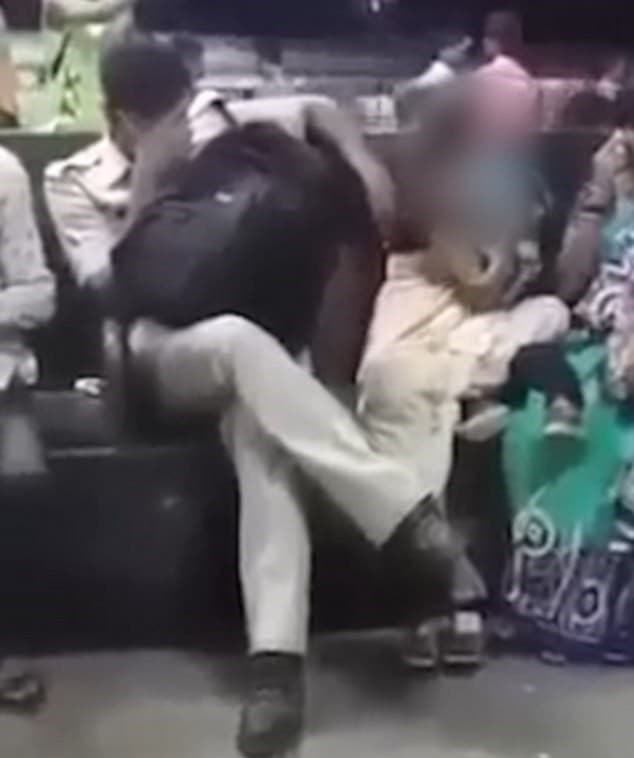 RPF officer Rajesh Jahangir groping a woman (YouTube)