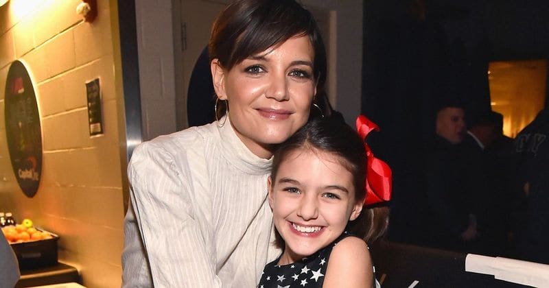 Suri Cruise is looking more like her mom every day, as she sells lemonade to revelers at the NYC Pride Parade