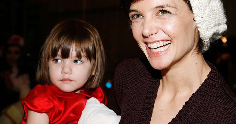 Suri Cruise is looking more like her mom every day, as she sells lemonade to revelers at the NYC Pride Parade