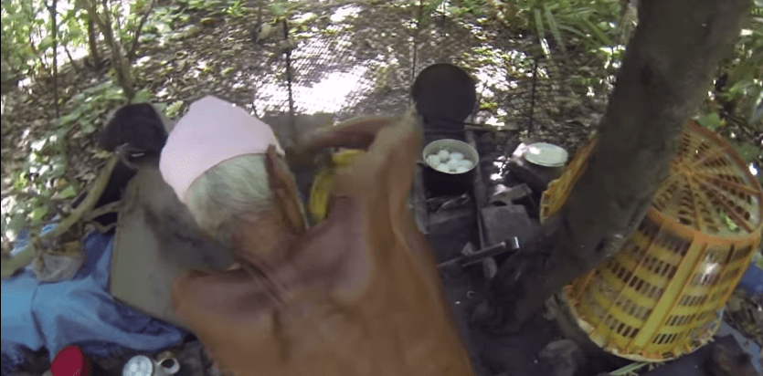 Nagasaki cooking in his makeshift kitchen. (Screengrab)