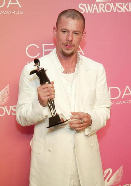 Designer Alexander McQueen, winner of the 'International Award' poses backstage at the '2003 CFDA Fashion Awards' at the New York Public Library on June 2, 2003 in New York City. The '2003 CFDA Fashion Awards' is underwritten by Swarovski, the internationally renowned purveyor of cut crystal. (Photo by Evan Agostini/Getty Images)