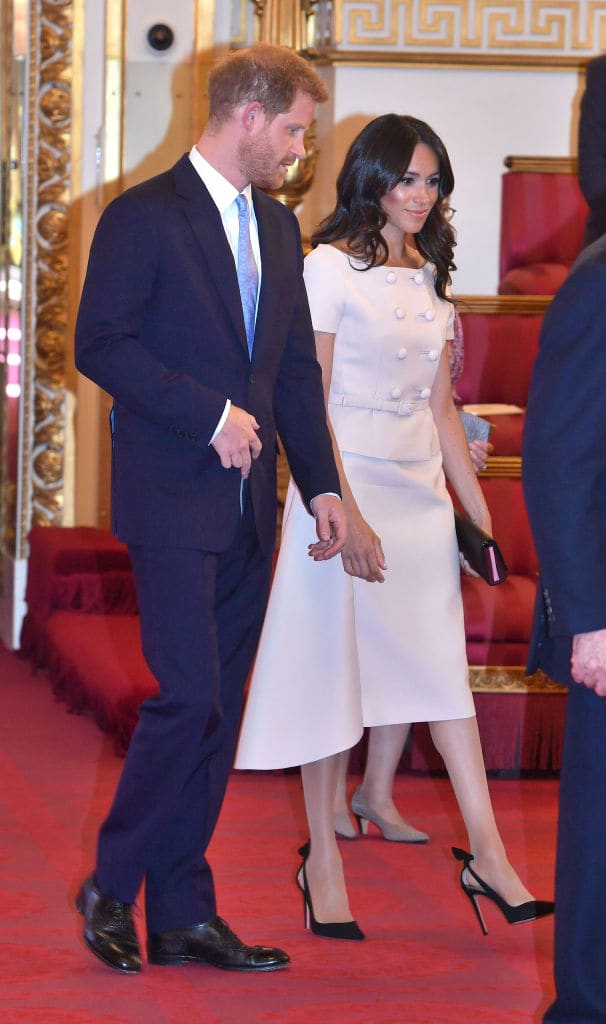 Harry and Meghan at the Queen's Young Leaders Awards Ceremony at Buckingham Palace on June 26, 2018 in London. The Queen's Young Leaders Programme, now in its fourth and final year, celebrates the achievements of young people from across the Commonwealth working to improve the lives of people across a diverse range of issues including supporting people living with mental health problems, access to education, promoting gender equality, food scarcity and climate change. (Getty Images)