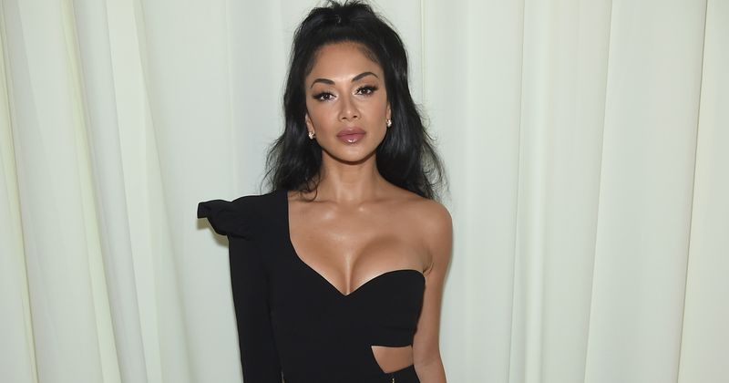 Nicole Scherzinger shows off her tiny waist as she attends fashion launch in Mykonos
