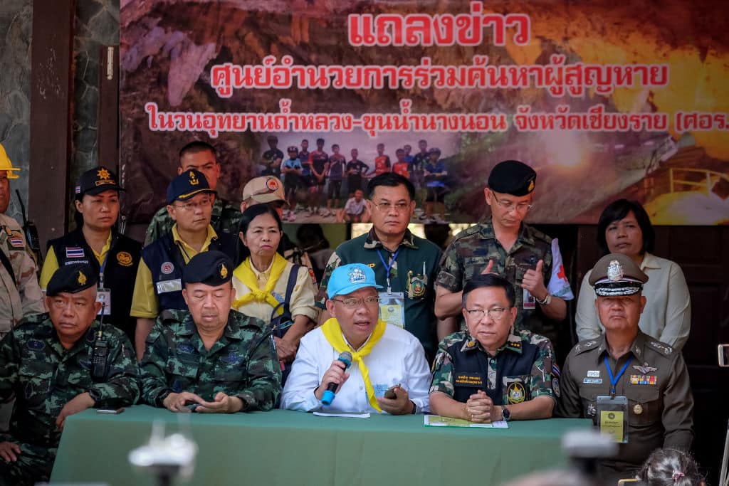 Chiang Rai Governor Narongsak Osot-tanakorn (center, blue hat), who heads the rescue operation, talk to the press at the Khun Nam Nang Non Forest Park to continue the rescue operation on July 04, 2018 in Chiang Rai, Thailand. (Photo by Linh Pham/Getty Images)