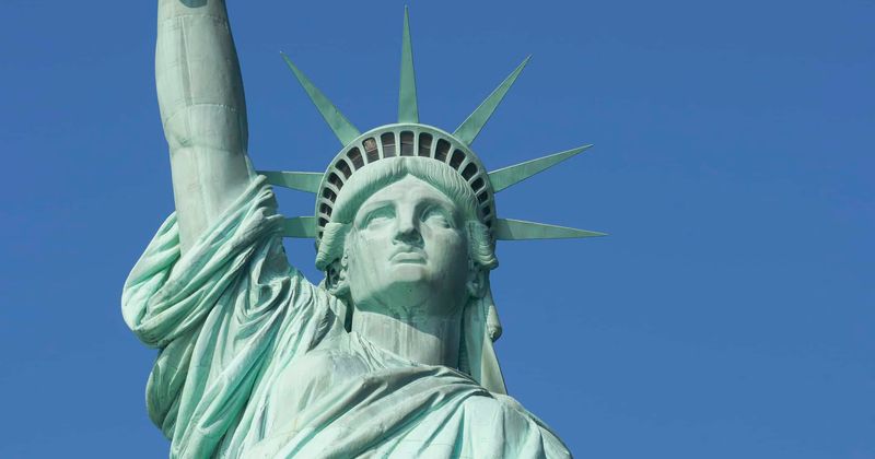 Liberty Island evacuated: Woman climbs Statue of Liberty as protesters are apprehended for 'abolish ICE' banner