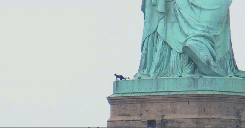 Liberty Island evacuated: Woman climbs Statue of Liberty as protesters are apprehended for 'abolish ICE' banner