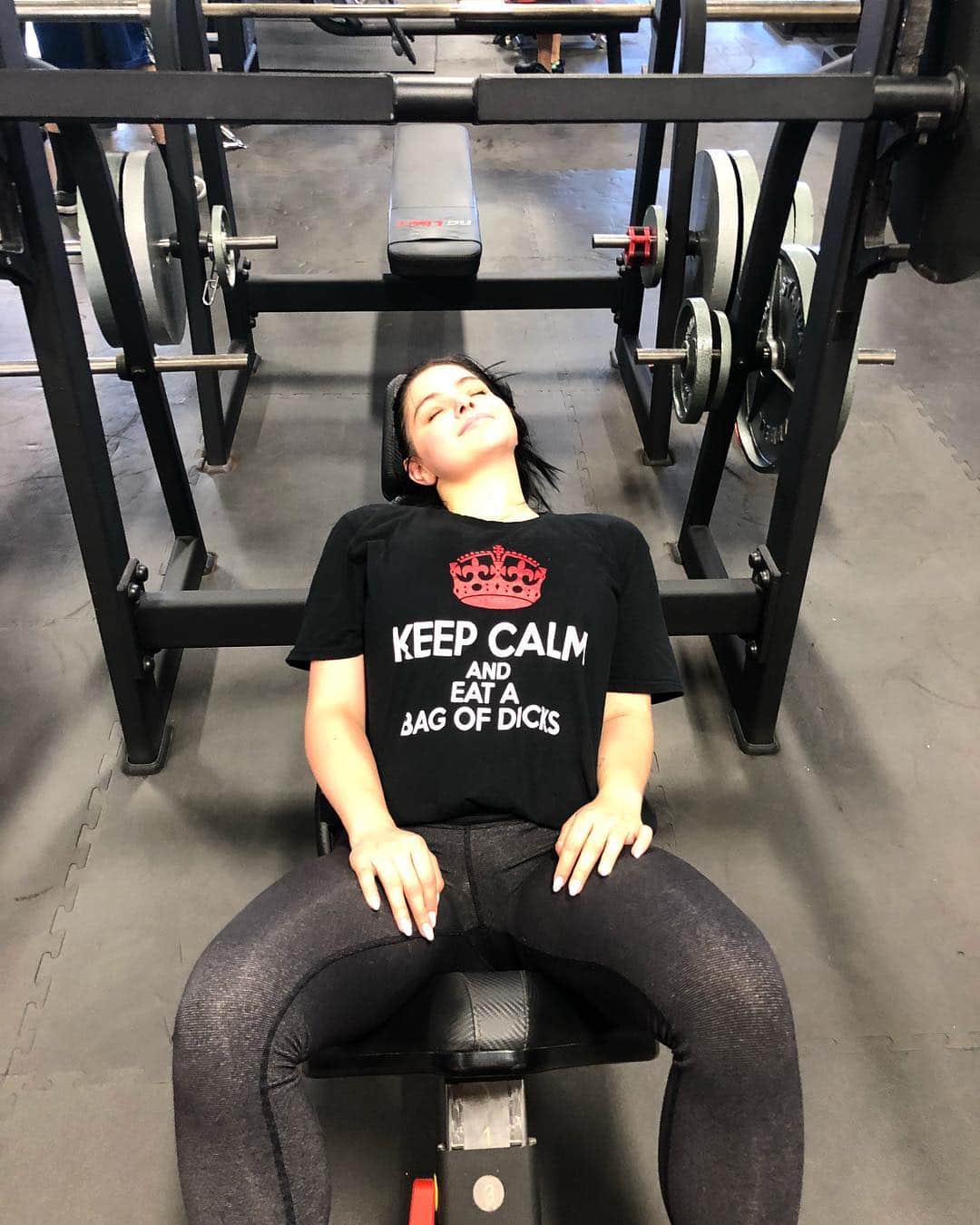 The explicit T-shirt Ariel chose to flaunt at the gym, read: 'keep calm and eat a bag of d**ks'. Source: Instagram