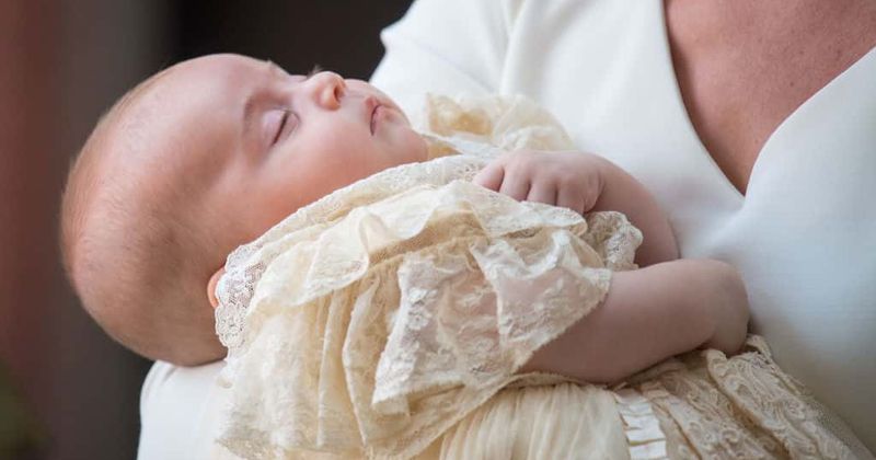 Queen and Prince Philip skip Prince Louis's christening as adorable prince rocks a hand-me-down gown