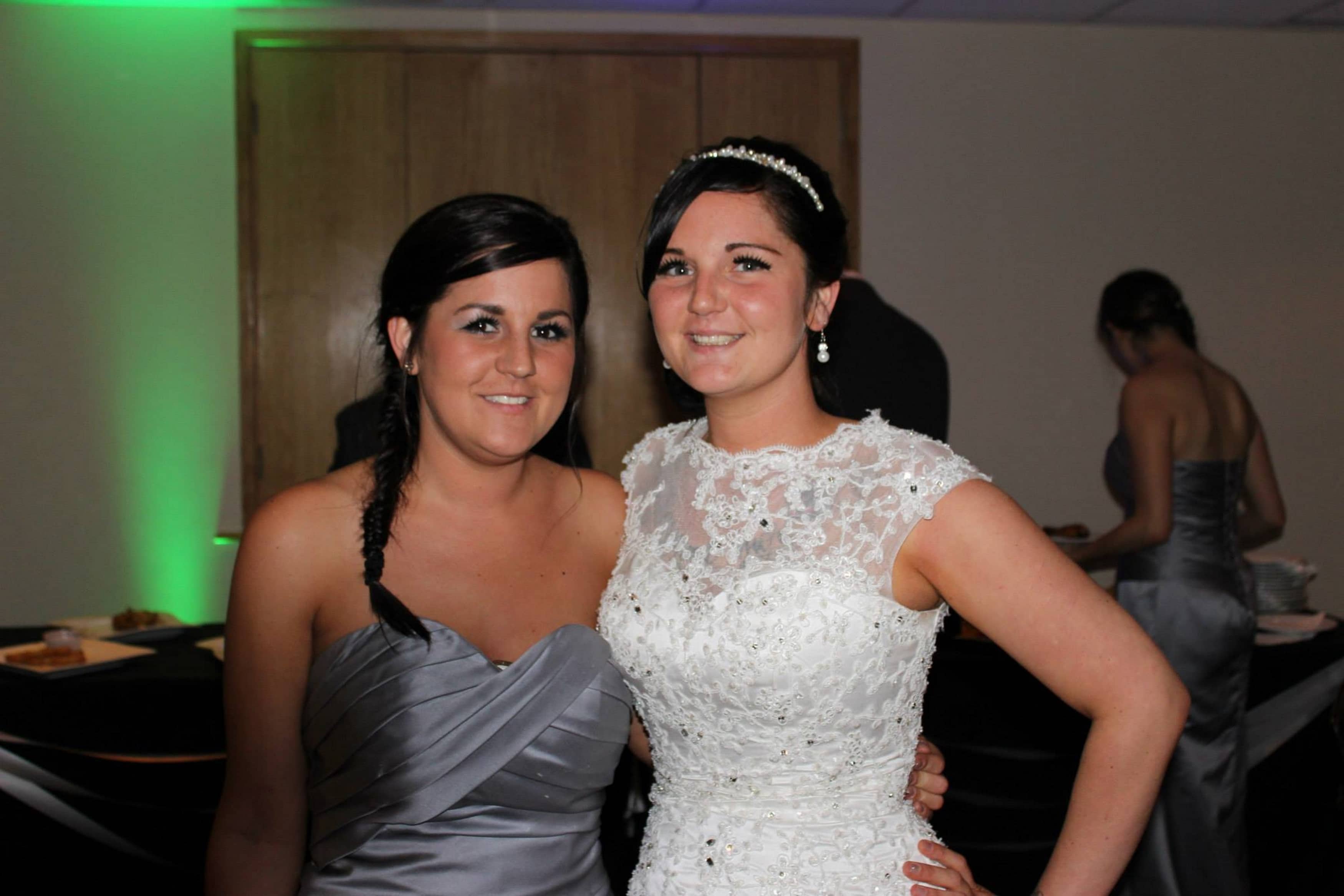 Ashleigh (right) on her wedding day with sister Stacie Kelly, who said the mum was "ripped inside out" (Image: Kennedy News and Media)