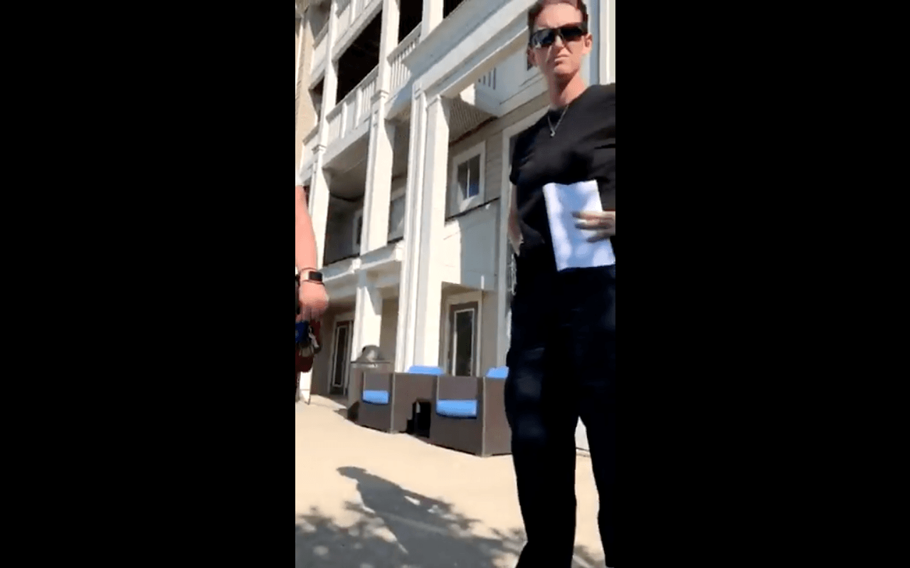 The security guard asking Holland to leave the pool area can be seen in this picture. (Twitter)