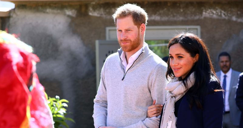 Prince Harry playfully warns a toddler who couldn't stop touching Meghan Markle's hair