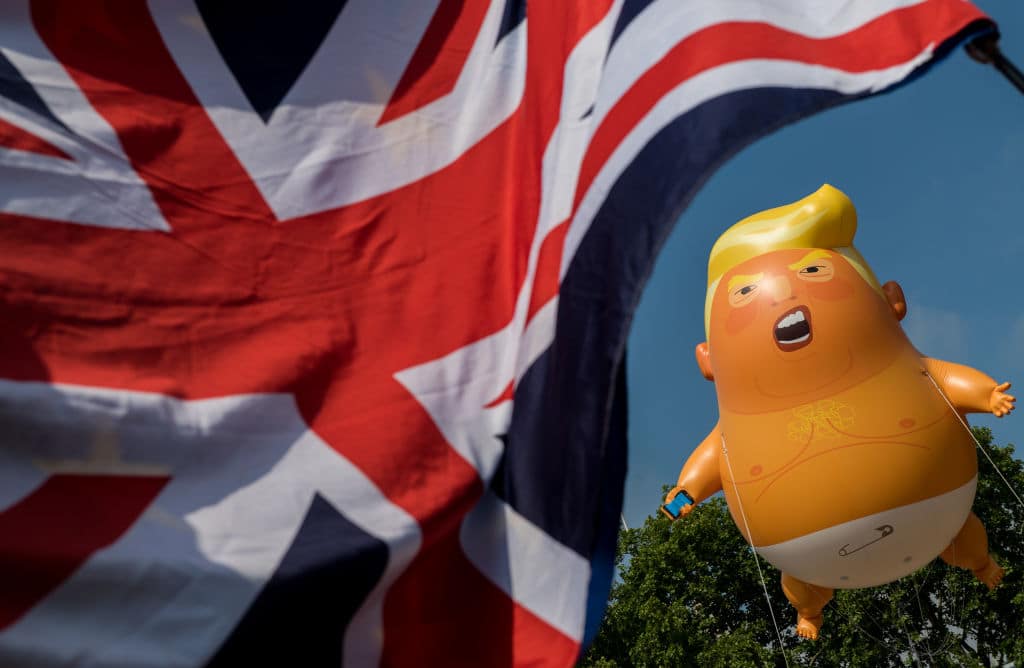 Demonstrators raise a six meter high effigy of Donald Trump, being dubbed the 'Trump Baby', in Parliament Square in protest against the U.S. President's current visit to the United Kingdom on July 13, 2018 in London, United Kingdom. (Getty Images)