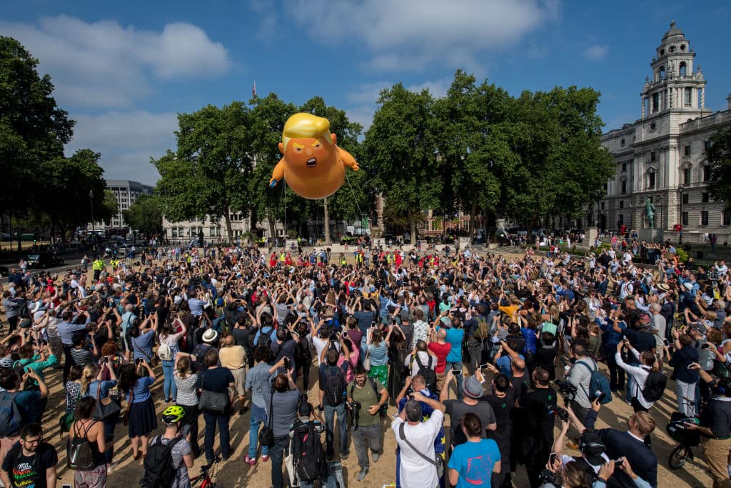 Demonstrators raise a six meter high effigy of Donald Trump, being dubbed the 'Trump Baby', in Parliament Square in protest against the U.S. President's current visit to the United Kingdom on July 13, 2018 in London, United Kingdom. (Getty Images)