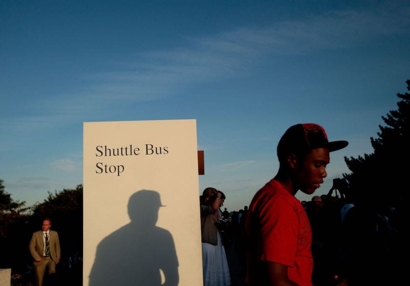 A teen waits near a bus stop outside the John F. Kennedy Presidential Library in Boston, Massachusetts. (Getty Images)