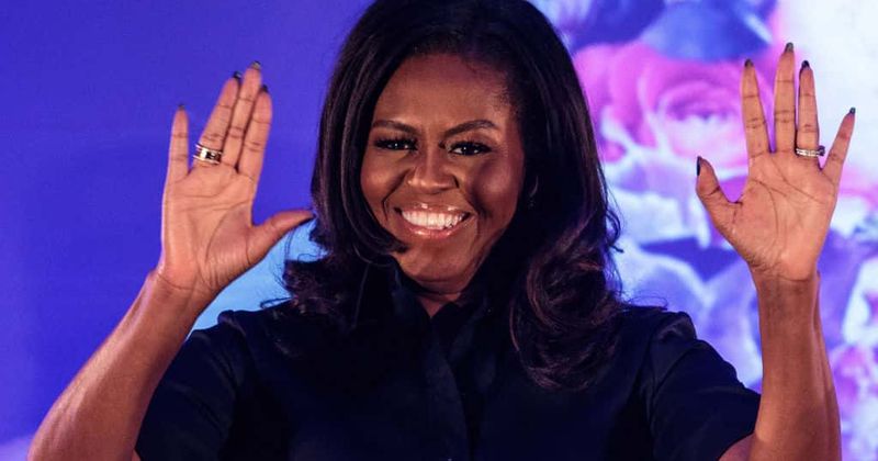 Michelle Obama throws down with the fans as she grooves at Jay-Z and Beyonce's Paris concert
