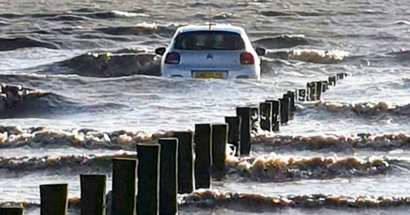 Stranded family dramatically rescued after car gets totally submerged as tide comes in