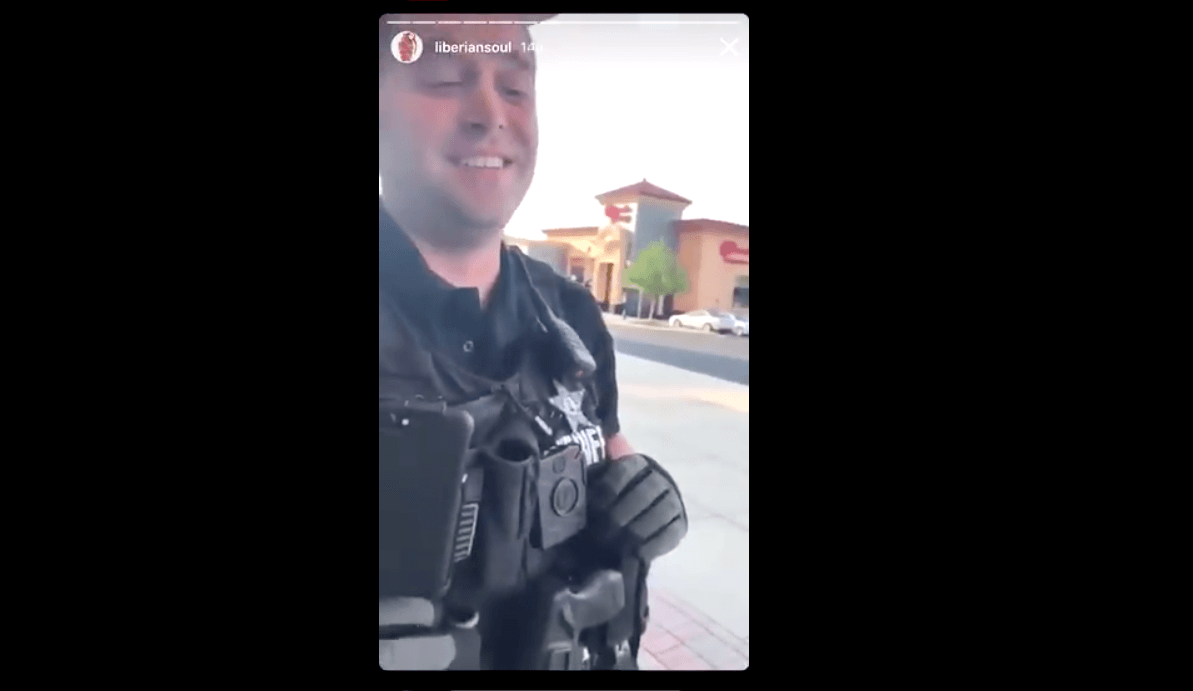 The officer laughs when asked if he was ever called over a basketball foul before. (Twitter/screnshot)