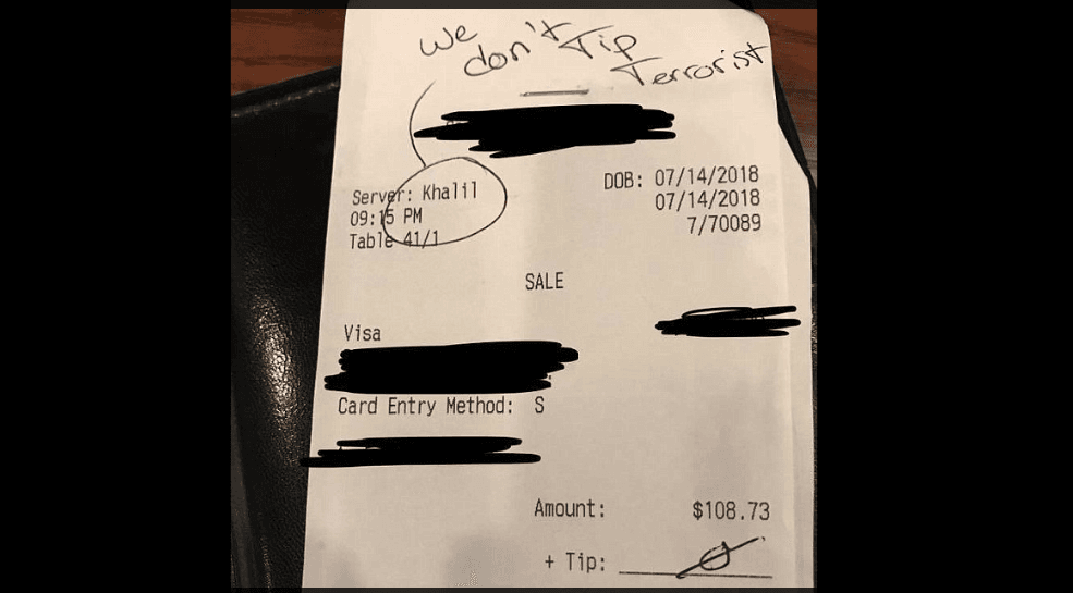 A picture of the note written on the bill by the racist customer. (Facebook)