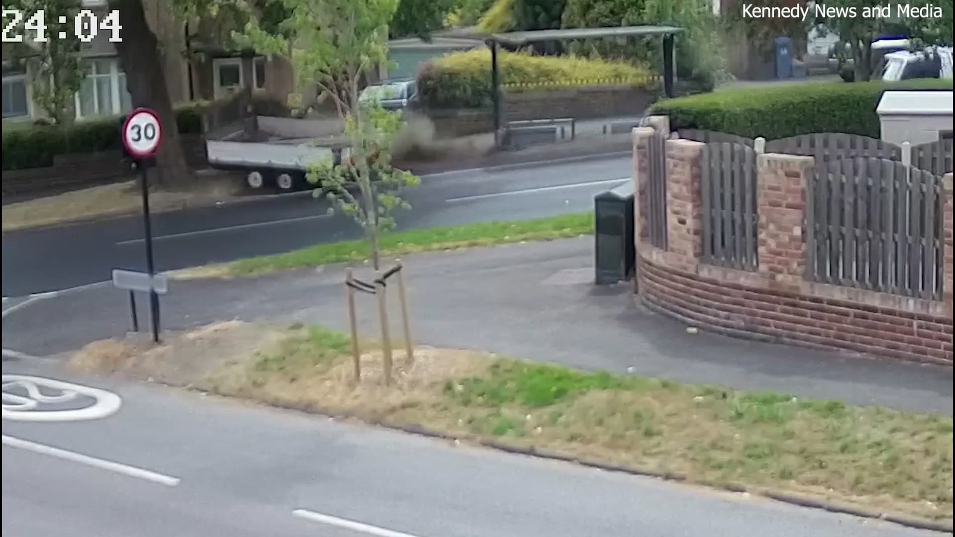 Footage shows the 10ft trailer race down the street in Sheffield, South Yorkshire, smashing through the edge of a bus shelter (Image: Kennedy News and Media)