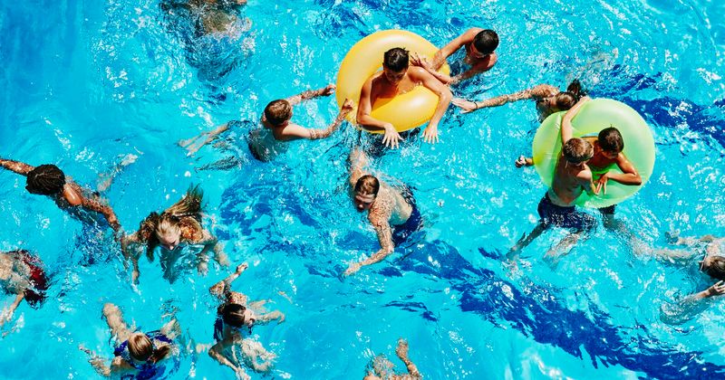 Breastfeeding mom holds protest outside aquatic center after being told "to cover up" at kiddie pool