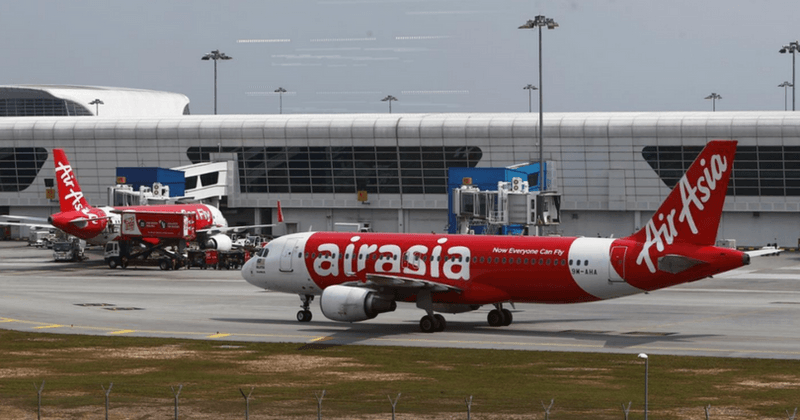 Infant's body found in airplane's toilet with its mouth's stuffed with paper; young mother held for questioning