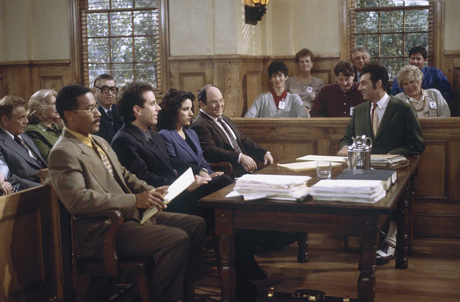 Phil Morris (left) as Jackie Chiles (Source: IMDb)