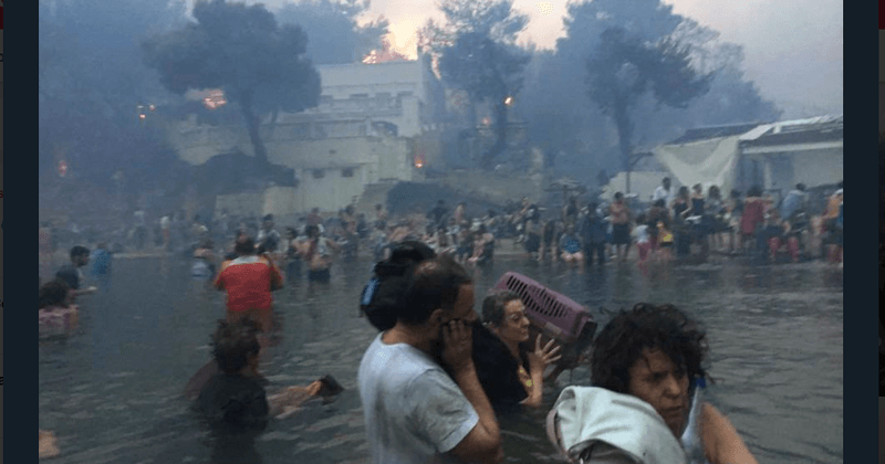 Terrifying clip shows petrified people huddling together in sea to escape deadly Greek wildfires