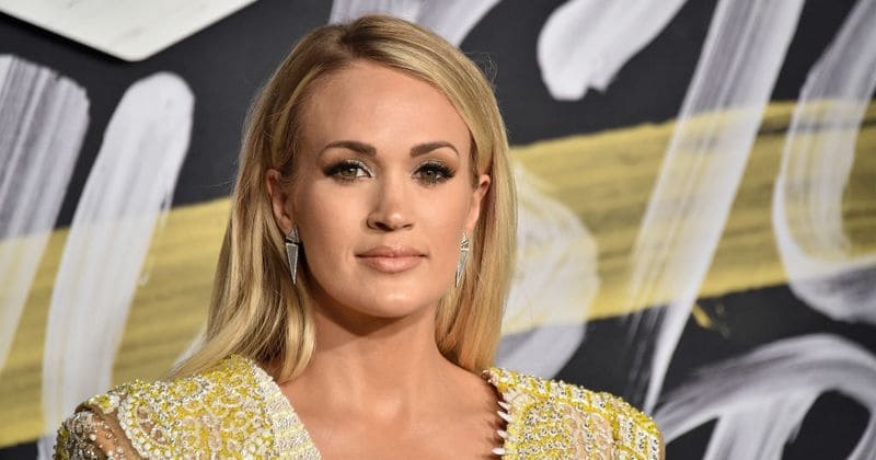 Carrie Underwood flips an "I don't care" to rumors involving her plastic surgery