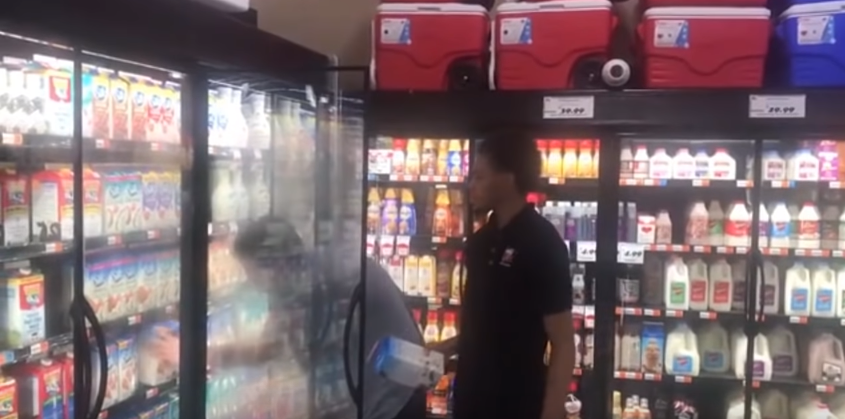 Taylor (R) helps Ryan (L) stack the dairy products. Source: YouTube