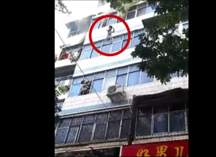 Screenshot of the clip shows the child being thrown out of the window. (Twitter)