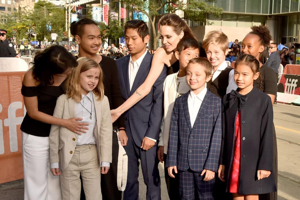 (L-R) Loung Ung, Vivienne Jolie-Pitt, Maddox Jolie-Pitt, Pax Jolie-Pitt, Angelina Jolie, Kimhak Mun, Knox Jolie-Pitt, Shiloh Jolie-Pitt, Zahara Jolie-Pitt and Sareum Srey Moch attend the 'First They Killed My Father' premiere during the 2017 Toronto International Film Festival at Princess of Wales Theatre on September 11, 2017 in Toronto, Canada. (Photo by Alberto E. Rodriguez/Getty Images)