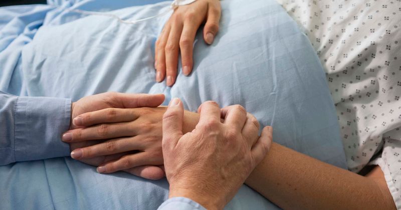 Photo captures tragic moment girlfriend lays her head on her boyfriend's chest, moments before his life support is turned off