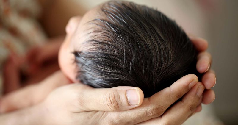 Father who 'breastfed' his newborn baby girl as mother battled for her life in ICU after delivery says it was a "huge honor"